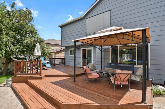 9665 Whitecliff Pl, Highlands Ranch, CO 80129 - wooden terrace with outdoor dining area and a gazebo