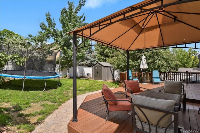 9665 Whitecliff Pl, Highlands Ranch, CO 80129 - wooden terrace with a trampoline, a gazebo, and an outdoor living space