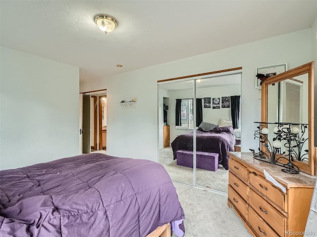 carpeted bedroom with a closet