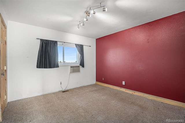 spare room featuring cooling unit and carpet floors