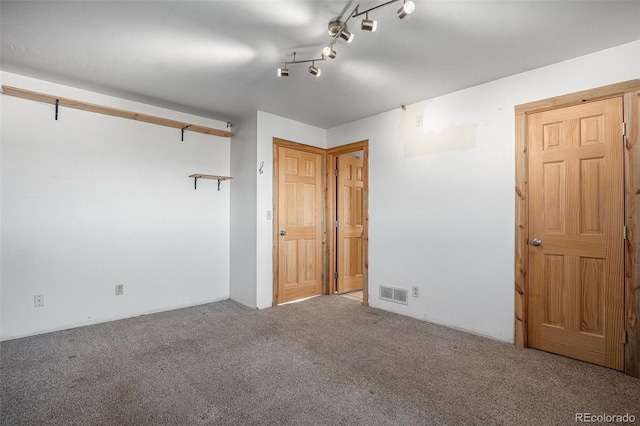 unfurnished bedroom featuring carpet flooring