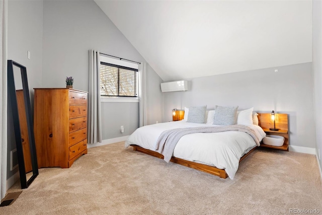 bedroom featuring baseboards, vaulted ceiling, an AC wall unit, and light colored carpet