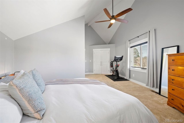 bedroom featuring light colored carpet, a ceiling fan, high vaulted ceiling, beamed ceiling, and baseboards