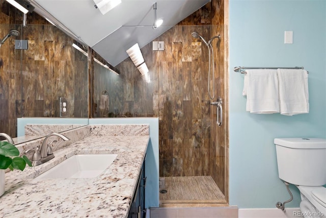 full bathroom with vaulted ceiling, vanity, toilet, and a shower stall