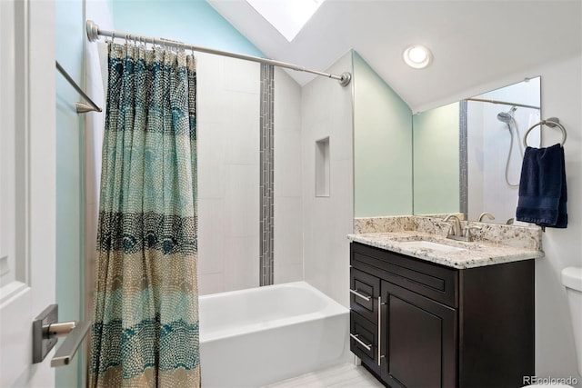 full bathroom featuring shower / tub combo with curtain, recessed lighting, toilet, vanity, and vaulted ceiling with skylight