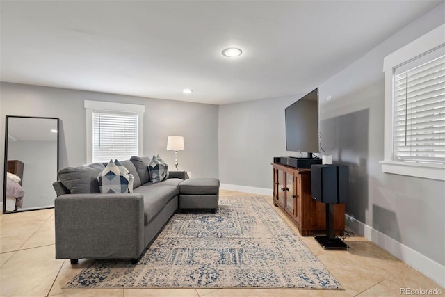 living room with recessed lighting, baseboards, and light tile patterned floors