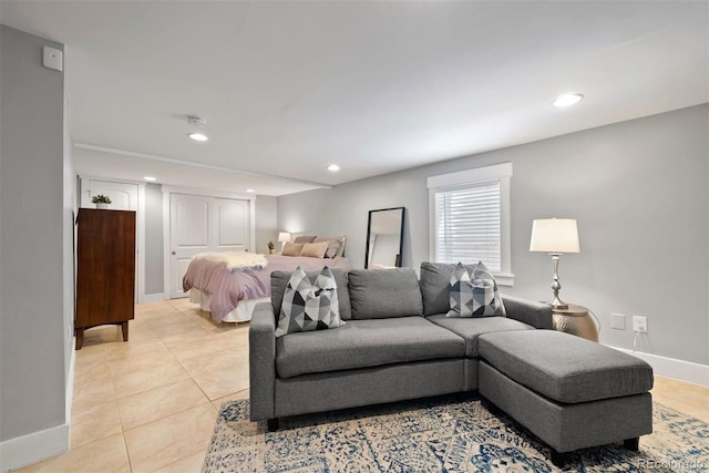 bedroom featuring recessed lighting, baseboards, and light tile patterned floors