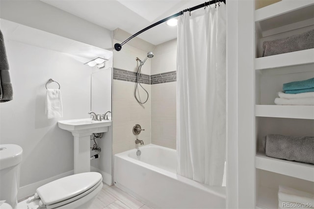 full bath featuring shower / tub combo with curtain and toilet