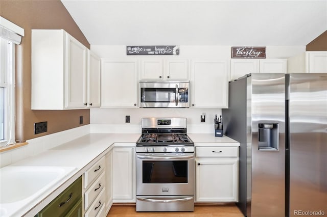 kitchen featuring white cabinetry, appliances with stainless steel finishes, and sink