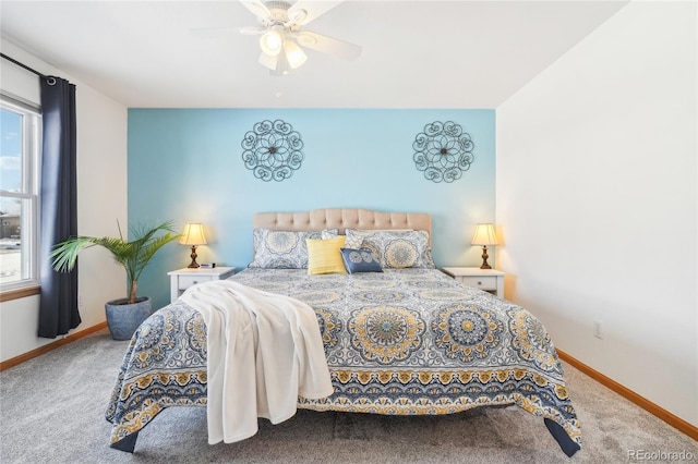 bedroom with ceiling fan, carpet, and multiple windows