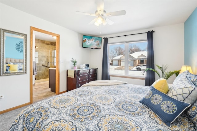 bedroom with light carpet, ceiling fan, and ensuite bathroom