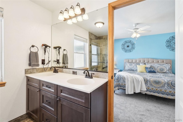 bathroom with walk in shower, ceiling fan, and vanity