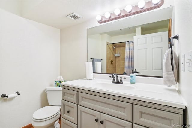 bathroom with a shower with curtain, vanity, and toilet