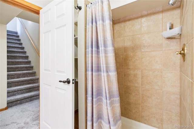 bathroom with shower / bath combination with curtain