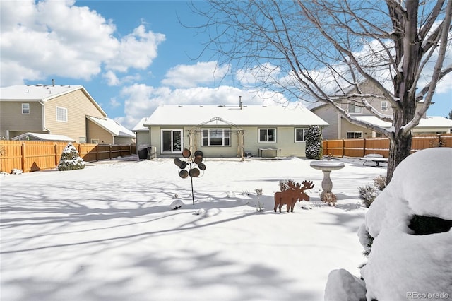 view of snow covered property