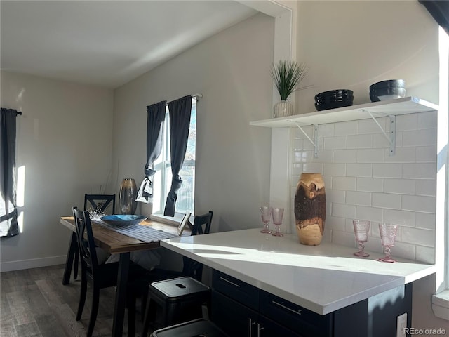 dining area with dark wood-type flooring