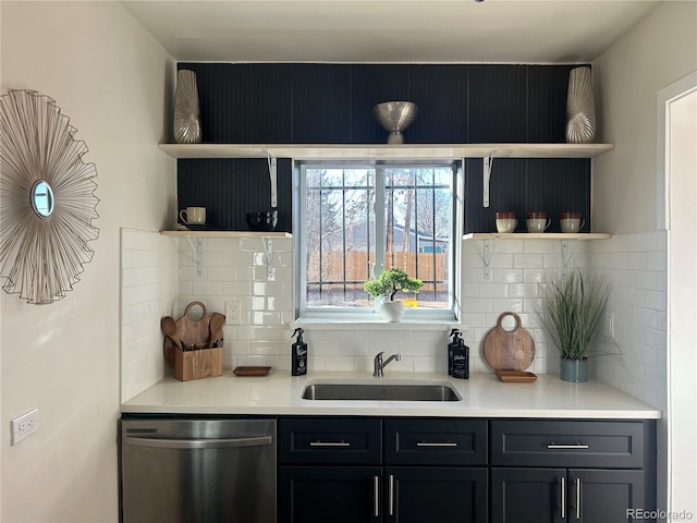 bar with sink, decorative backsplash, and stainless steel dishwasher