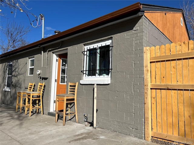 view of property exterior featuring a patio area