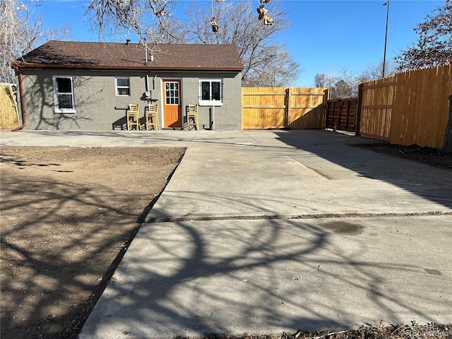 rear view of property featuring a patio