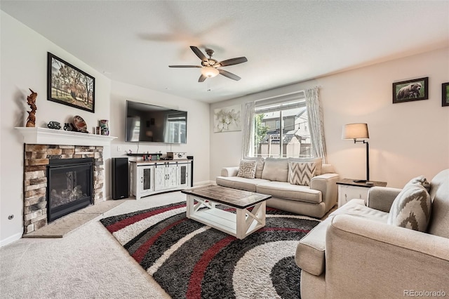 25128 E Maple Ave, Aurora, CO 80018 - carpeted living room featuring a ceiling fan, baseboards, and a fireplace