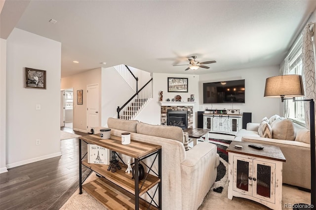 25128 E Maple Ave, Aurora, CO 80018 - living area featuring a stone fireplace, a ceiling fan, wood finished floors, recessed lighting, and stairs