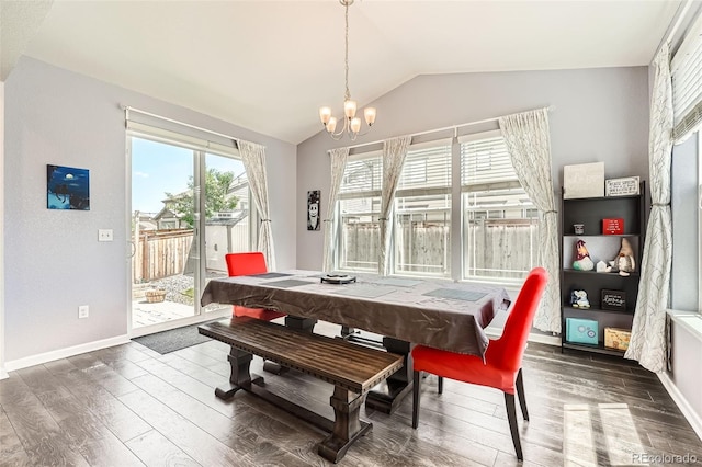 25128 E Maple Ave, Aurora, CO 80018 - dining room featuring vaulted ceiling, wood finished floors, a chandelier, and baseboards