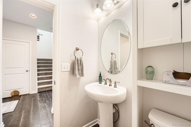 25128 E Maple Ave, Aurora, CO 80018 - half bathroom featuring toilet and wood finished floors