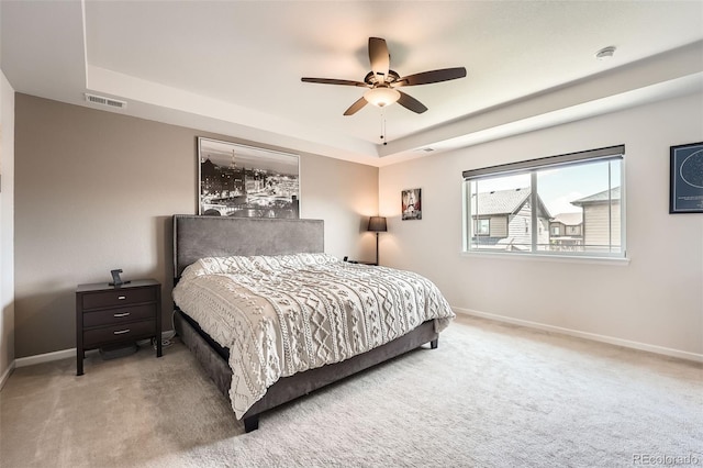 25128 E Maple Ave, Aurora, CO 80018 - carpeted bedroom with a raised ceiling, baseboards, and ceiling fan