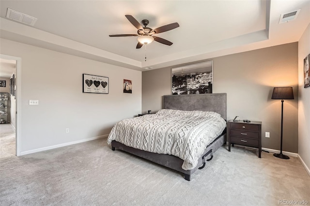 25128 E Maple Ave, Aurora, CO 80018 - bedroom with carpet, a tray ceiling, baseboards, and a ceiling fan