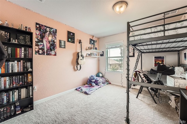 25128 E Maple Ave, Aurora, CO 80018 - bedroom featuring a textured wall, carpet floors, and baseboards