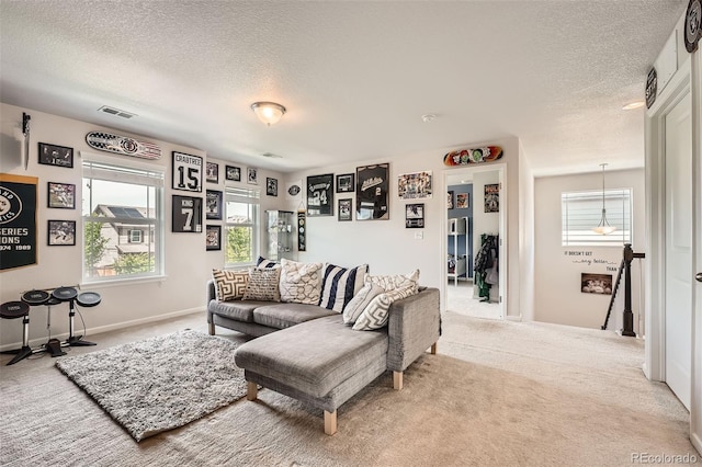 25128 E Maple Ave, Aurora, CO 80018 - carpeted living area with a textured ceiling and baseboards