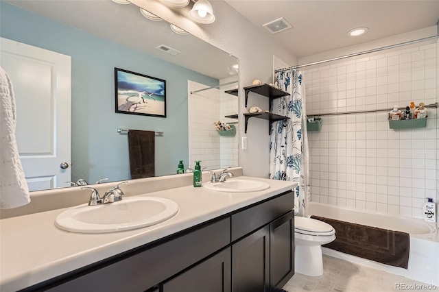 25128 E Maple Ave, Aurora, CO 80018 - bathroom with double vanity, toilet, shower / tub combo with curtain, and tile patterned floors