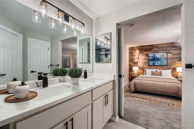 bathroom with vanity and wood walls