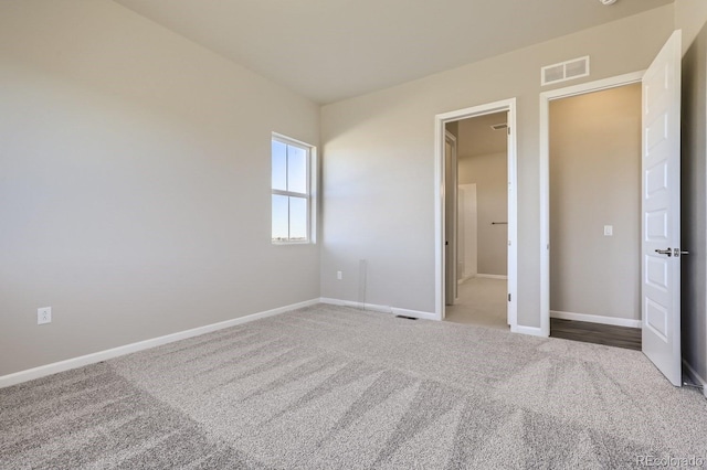 unfurnished bedroom with carpet