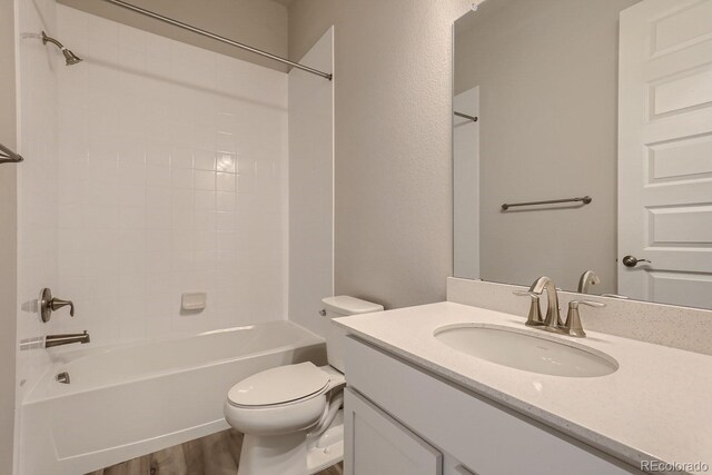 full bathroom featuring shower / bathing tub combination, vanity, toilet, and wood-type flooring