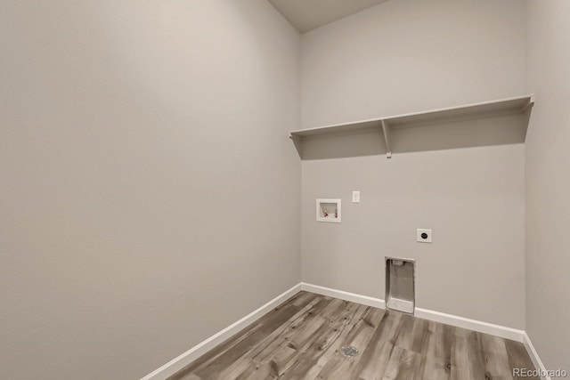 washroom with hookup for an electric dryer, wood-type flooring, and hookup for a washing machine