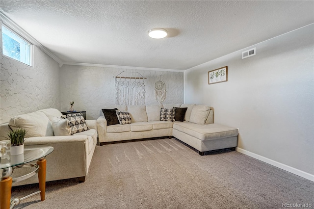 carpeted living room featuring visible vents, a textured wall, ornamental molding, a textured ceiling, and baseboards