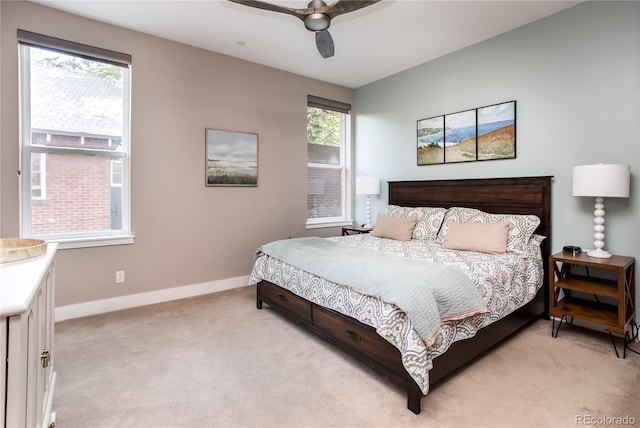 bedroom with light colored carpet and ceiling fan