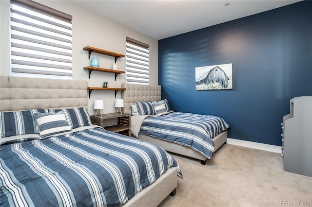 bedroom featuring light colored carpet