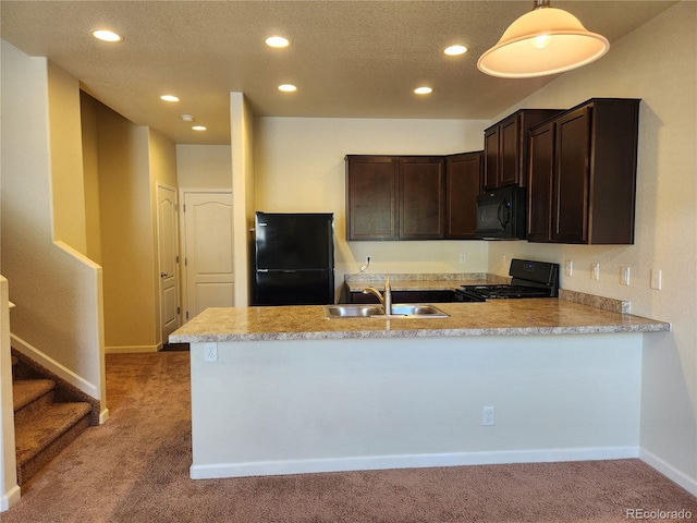 1211 Bistre St, Longmont, CO 80501 - kitchen with black appliances, a sink, carpet flooring, dark brown cabinetry, and a peninsula