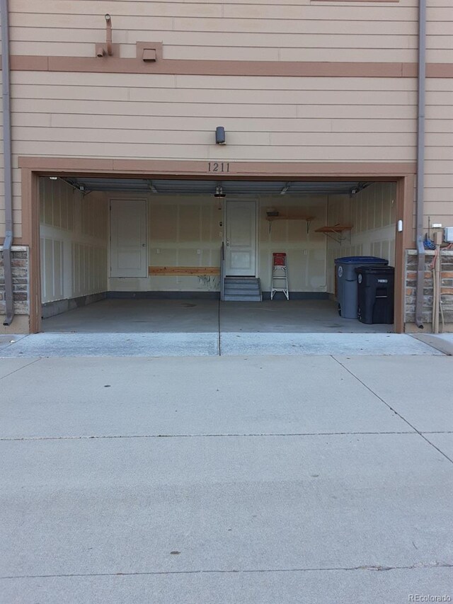 1211 Bistre St, Longmont, CO 80501 - garage featuring concrete driveway