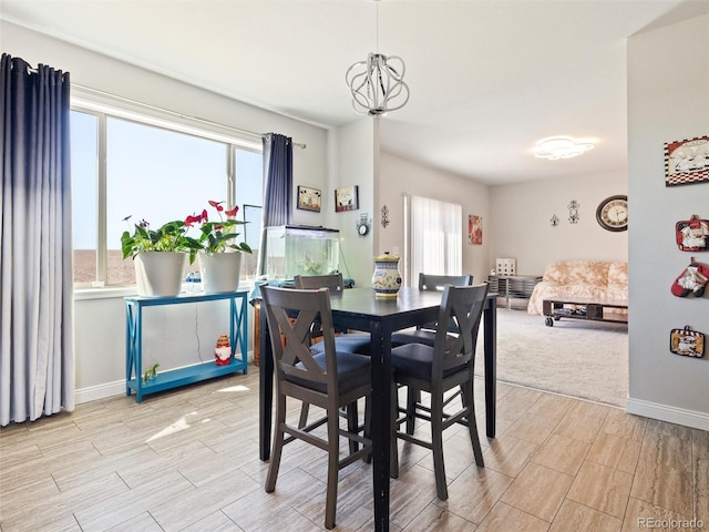 dining space featuring wood finish floors and baseboards