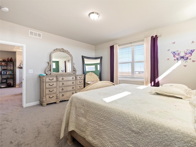 bedroom with baseboards, visible vents, and carpet flooring