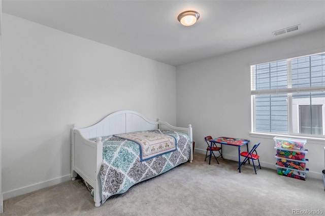 bedroom featuring visible vents, baseboards, and carpet floors