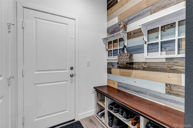 mudroom with baseboards and wood finished floors