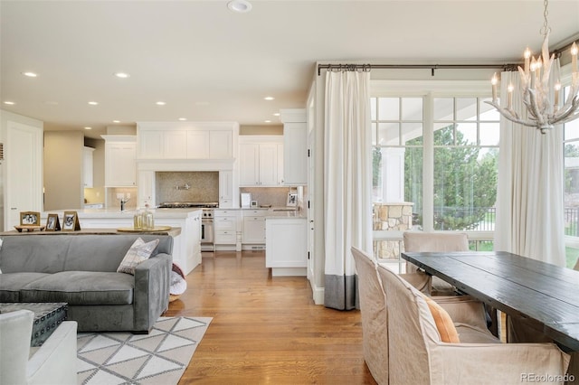5425 S University Blvd, Greenwood Village, CO 80121 - living area with a chandelier, recessed lighting, and light wood-type flooring