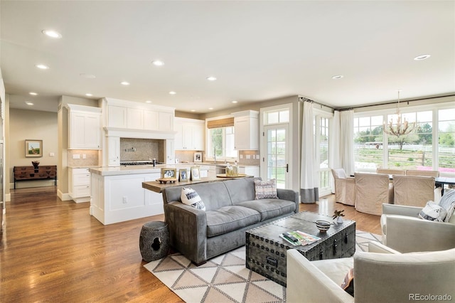 5425 S University Blvd, Greenwood Village, CO 80121 - living area with a chandelier, recessed lighting, and light wood-style flooring