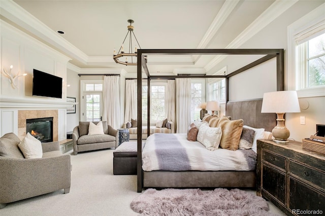 5425 S University Blvd, Greenwood Village, CO 80121 - bedroom featuring crown molding, multiple windows, a tile fireplace, carpet floors, and a raised ceiling