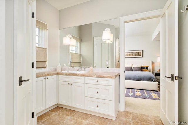 5425 S University Blvd, Greenwood Village, CO 80121 - bathroom with vanity, connected bathroom, and tile patterned flooring