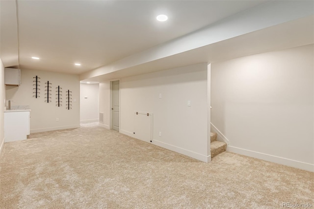 4714 S Simms Ct, Morrison, CO 80465 - finished below grade area featuring light carpet, recessed lighting, and stairway